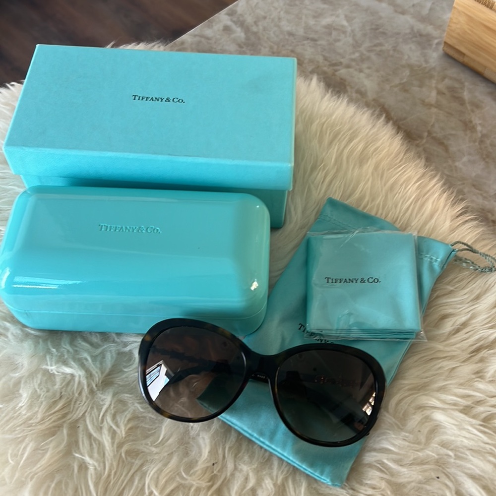Tiffany & Co. Sunglasses with pearly and crystals ornaments on each wing.